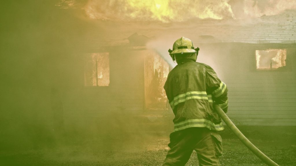 Firefighter Putting Out A Home Fire